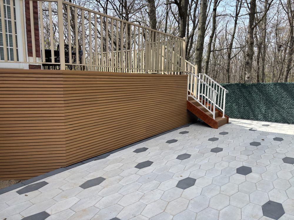 Finished composite deck skirting and stair enclosure by Elevate Tent Design